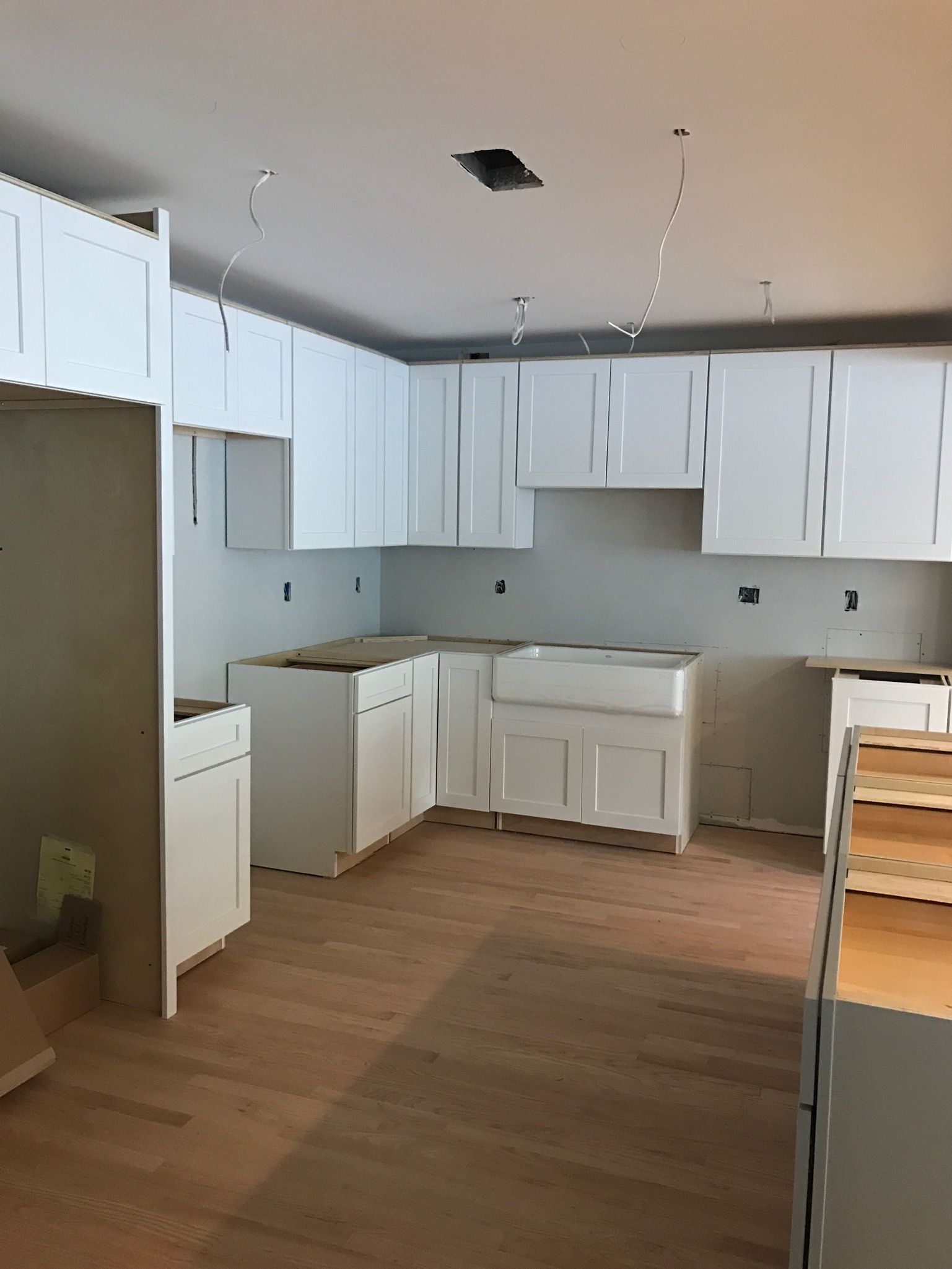 new cabinets/wood floor installed