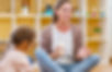 Kindergarten teacher with children sitting on the floor having music class, using various