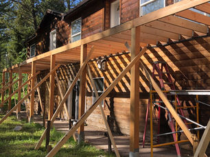 is it cheaper to buy land and build a house in Wyoming?