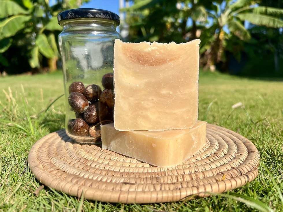 Two bars of Rice, Shea Butter & Coconut soap on a woven mat.