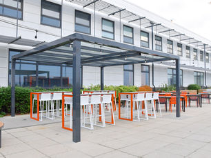 Zoned school outdoor area with benches and learning stations