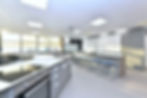 Fully equipped school food tech room with height-adjustable hobs and sinks