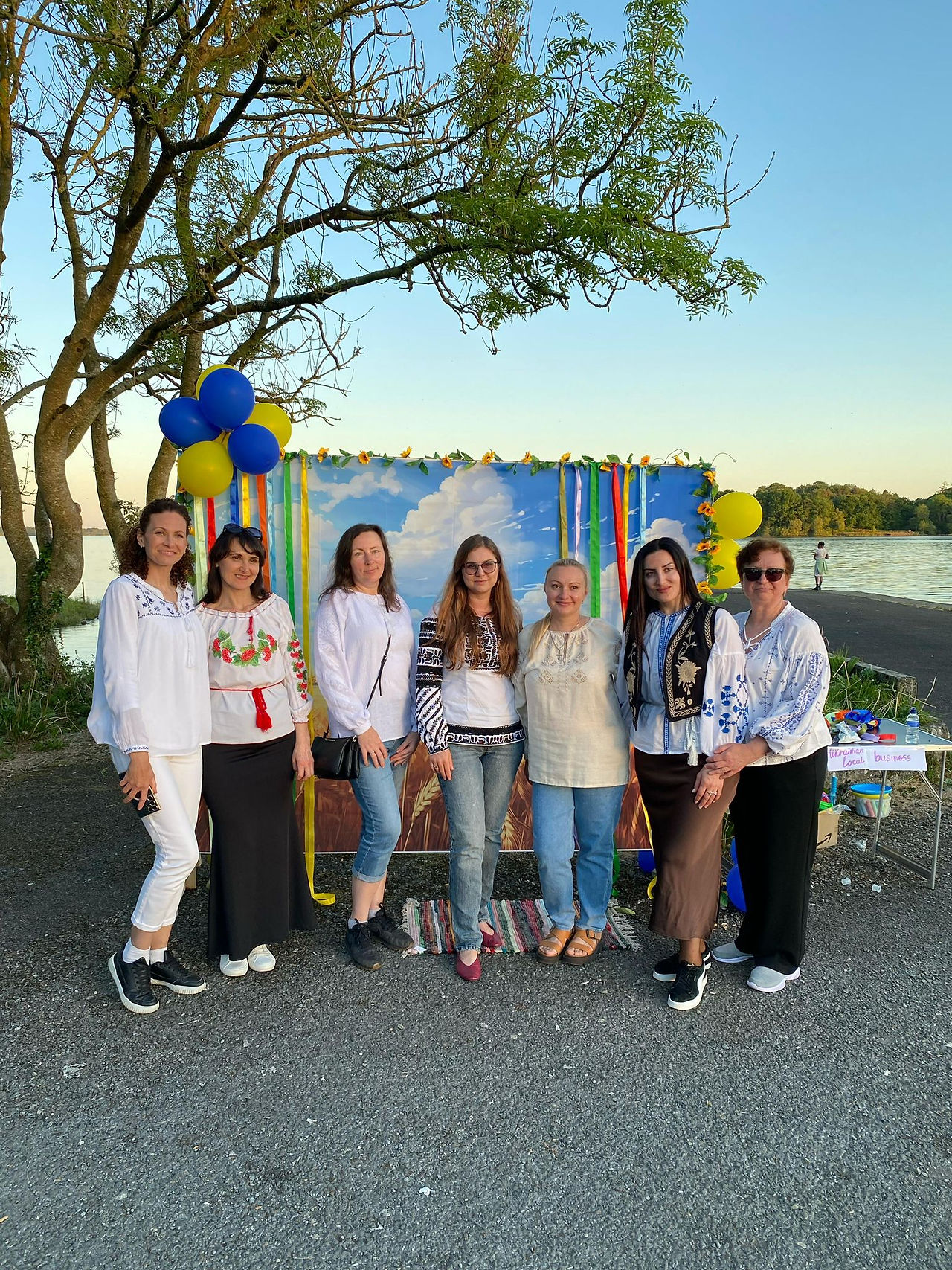 Group of women posing for a photo at an outdoor event