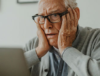 Grandpa is worried about something on his computer.