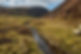 Scenic river winding through the grassy landscapes of the Scottish Highlands