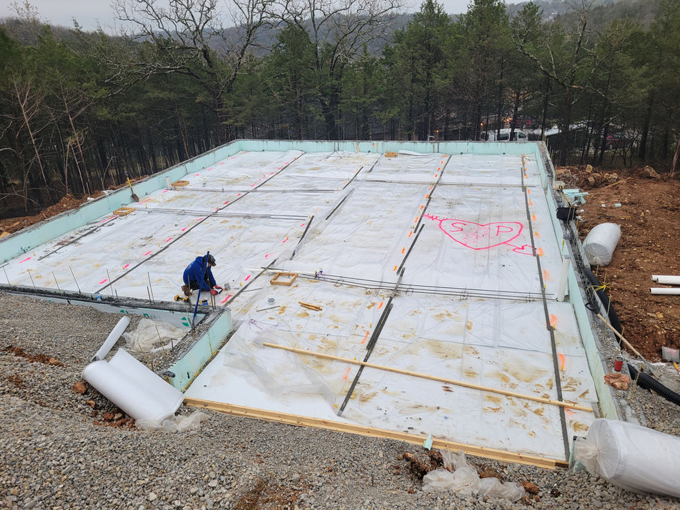 Construction site with foundation work in progress.