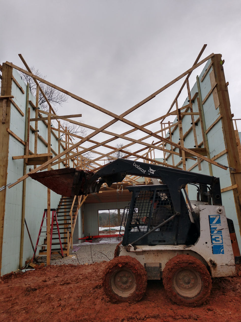 Construction site with machinery and scaffolding.