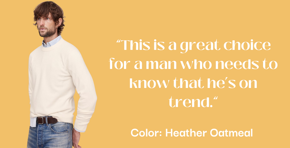 Person wearing a light-colored sweater over a light blue collared shirt, paired with blue jeans and a brown belt. Face obscured by a brown square. Text: "This is a great choice for a man who needs to know that he’s on trend." Color: Heather Oatmeal. Background: light orange.