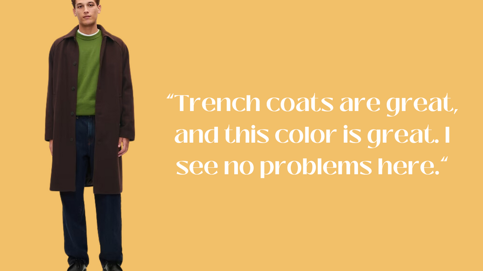 A person wearing a brown trench coat over a green sweater and dark pants, standing against a light orange background. Text to the right reads: "Trench coats are great, and this color is great. I see no problems here."