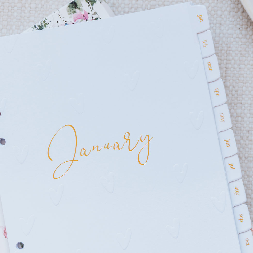 Thumbnail: Laminated monthly tab dividers laid flat on white desk
