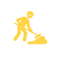 Construction worker with a shovel spreading material, representing asphalt patching or surface preparation services.