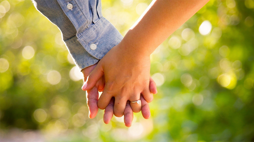 Couple holding hands