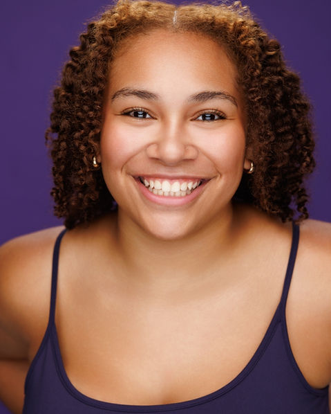 Young black female actor theatrical headshot against purple background