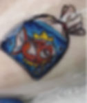 Magikarp in a fish bag Tattoo