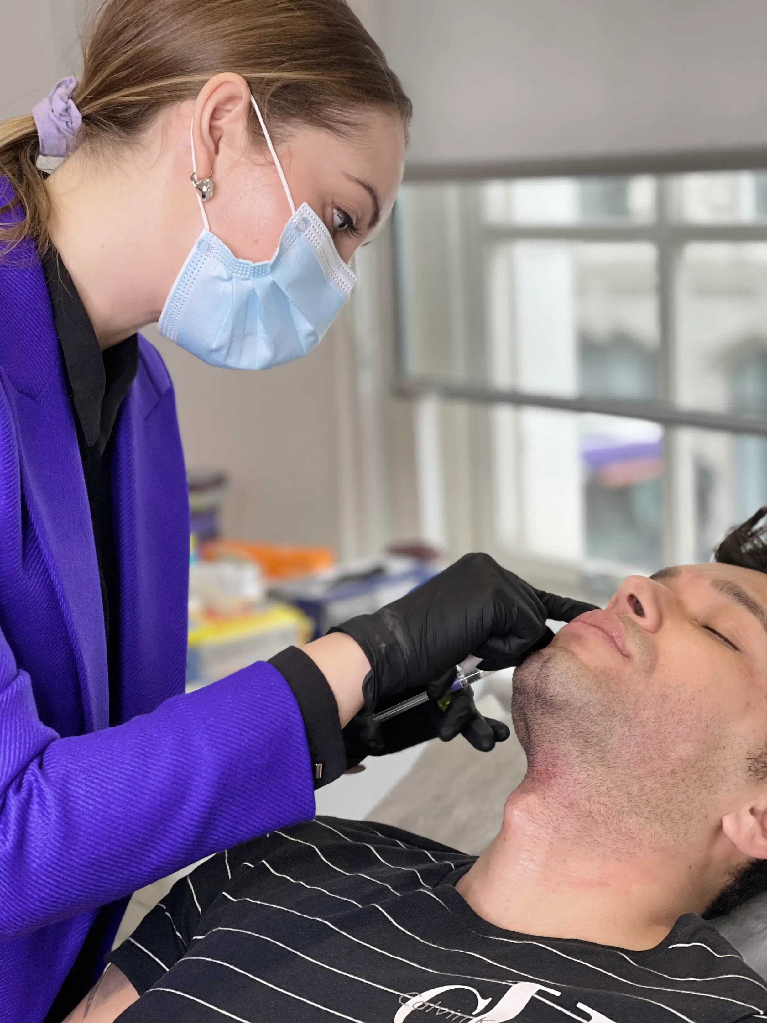 young man undergoing dermal fillers treatment