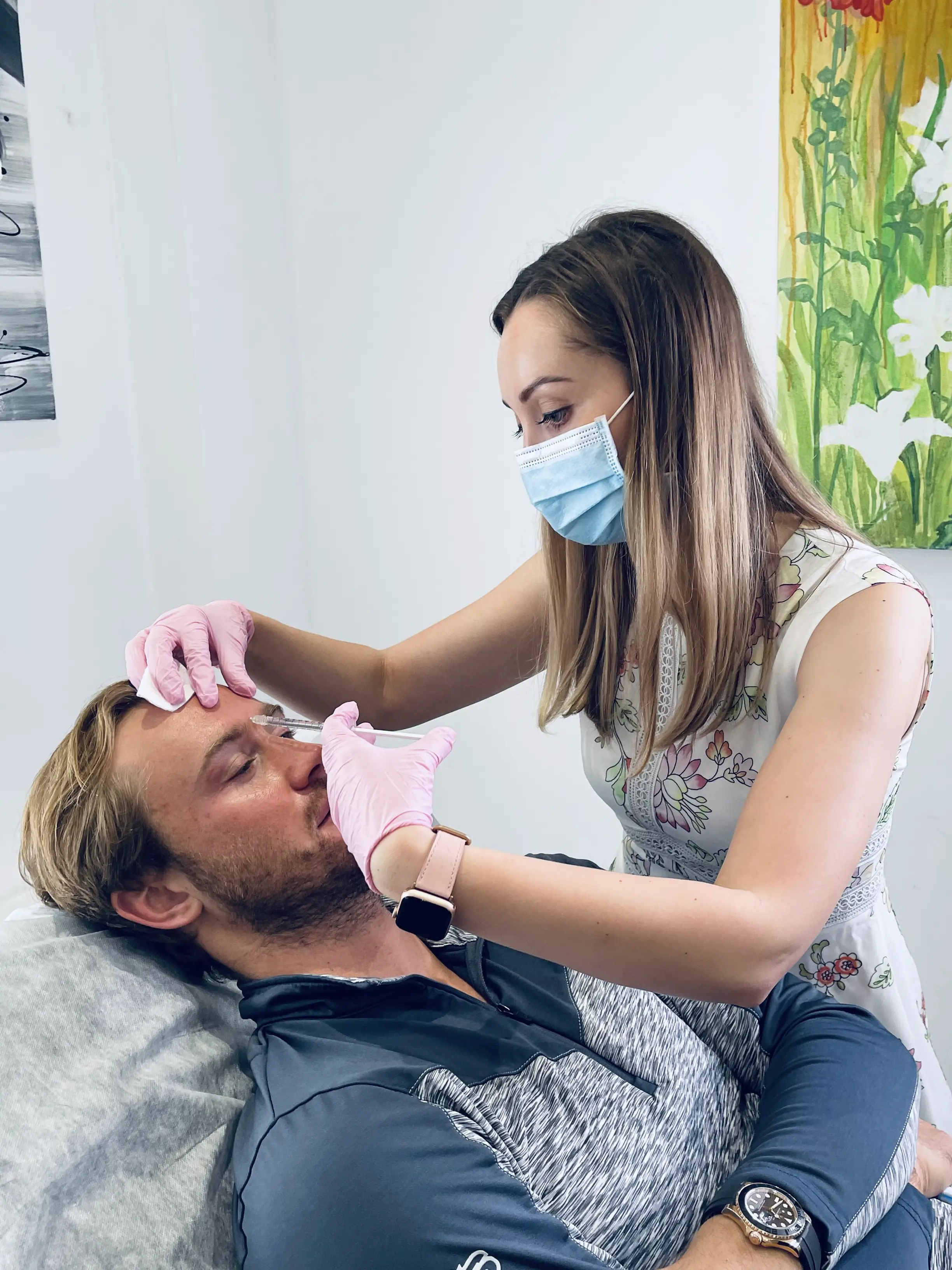 aesthetic practitioner performs botox treatment on a young handsome man