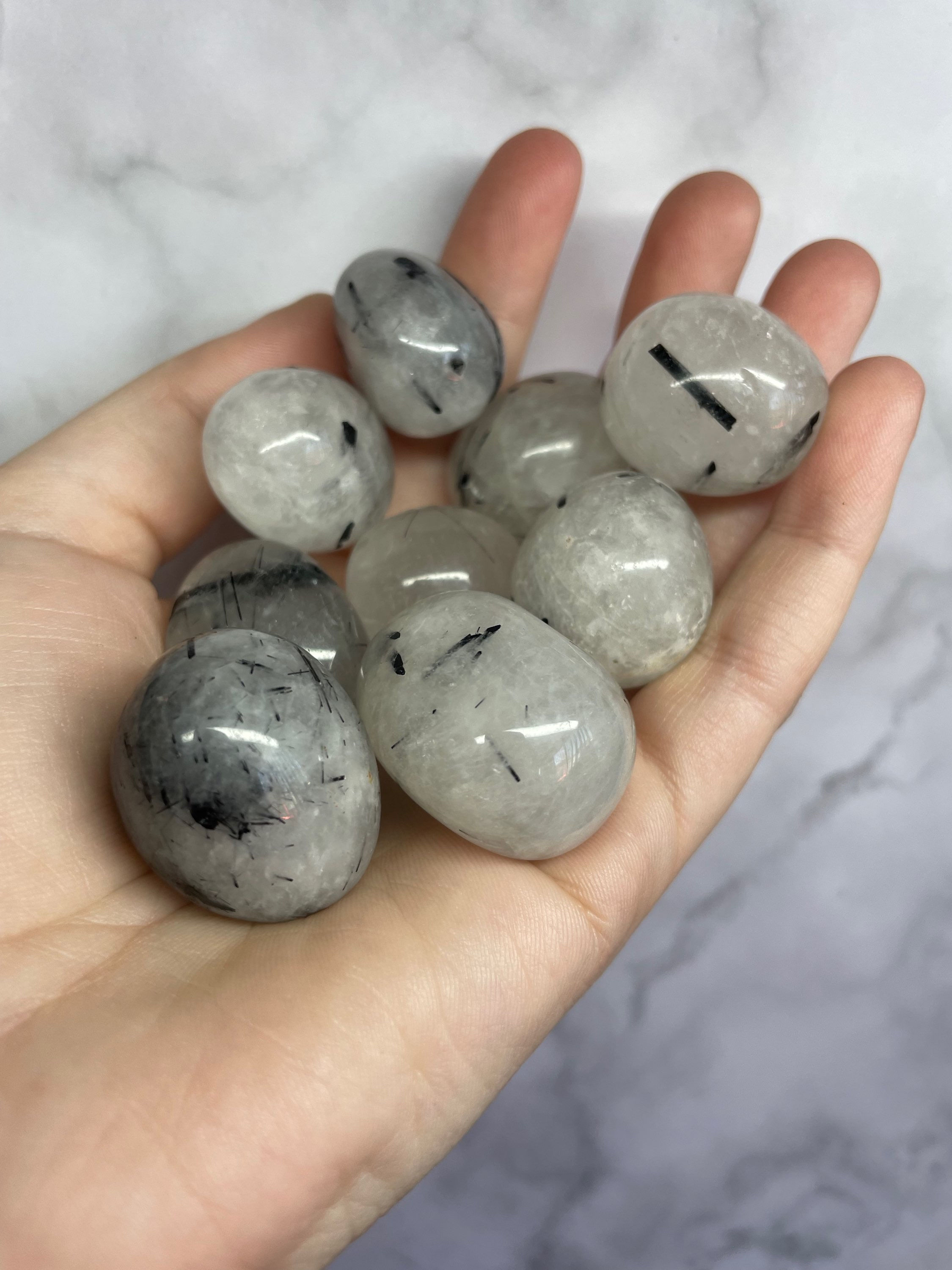 Black tourmaline in quartz tumbles