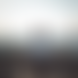 Man sitting outdoors overlooking open land in calm reflection, symbolizing shame-free porn addiction recovery through self-leadership and emotional integration