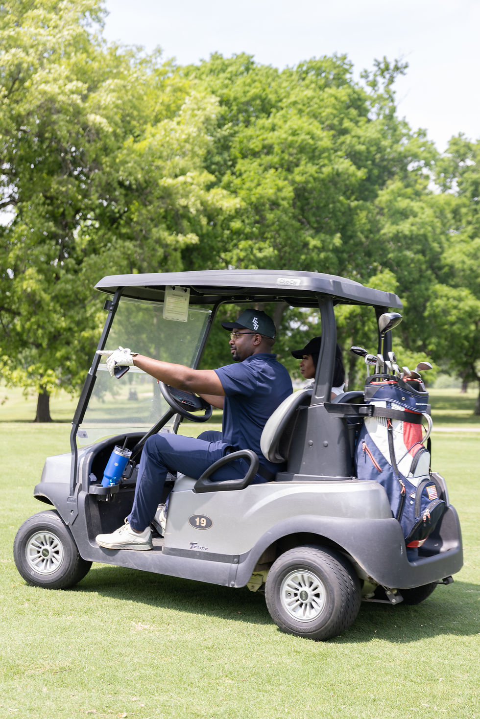 Eye-level view of a golf course with lush green fairways