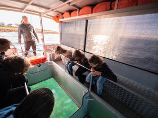 The captain talking about the marine wildlife