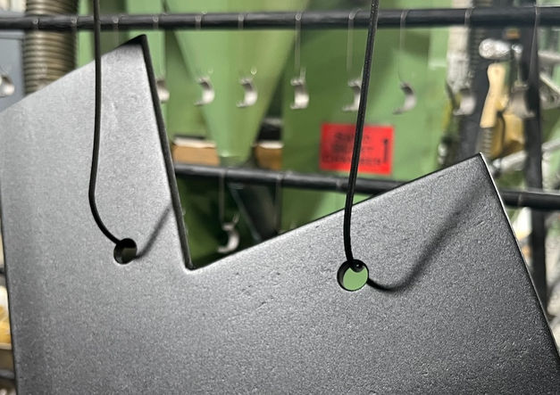 Brackets coated with powder coating on racking