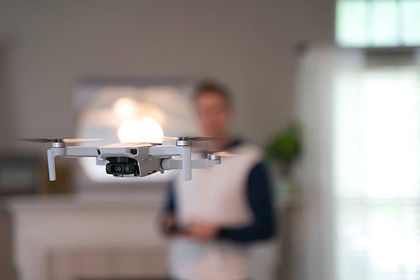 stock-photo-drone-flying-indoors-pilot-visible.jpg