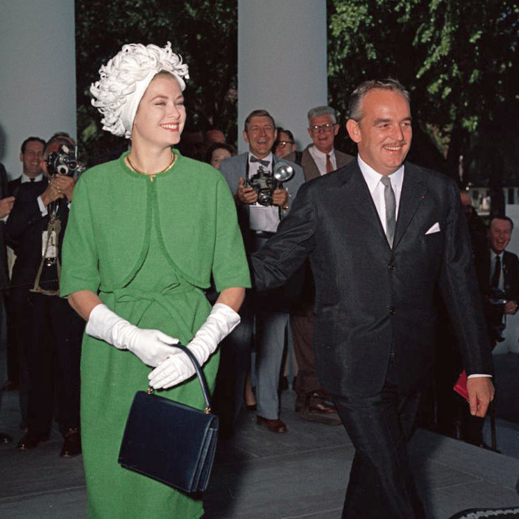 Prince Rainier III and Princess Grace with reporters in the background
