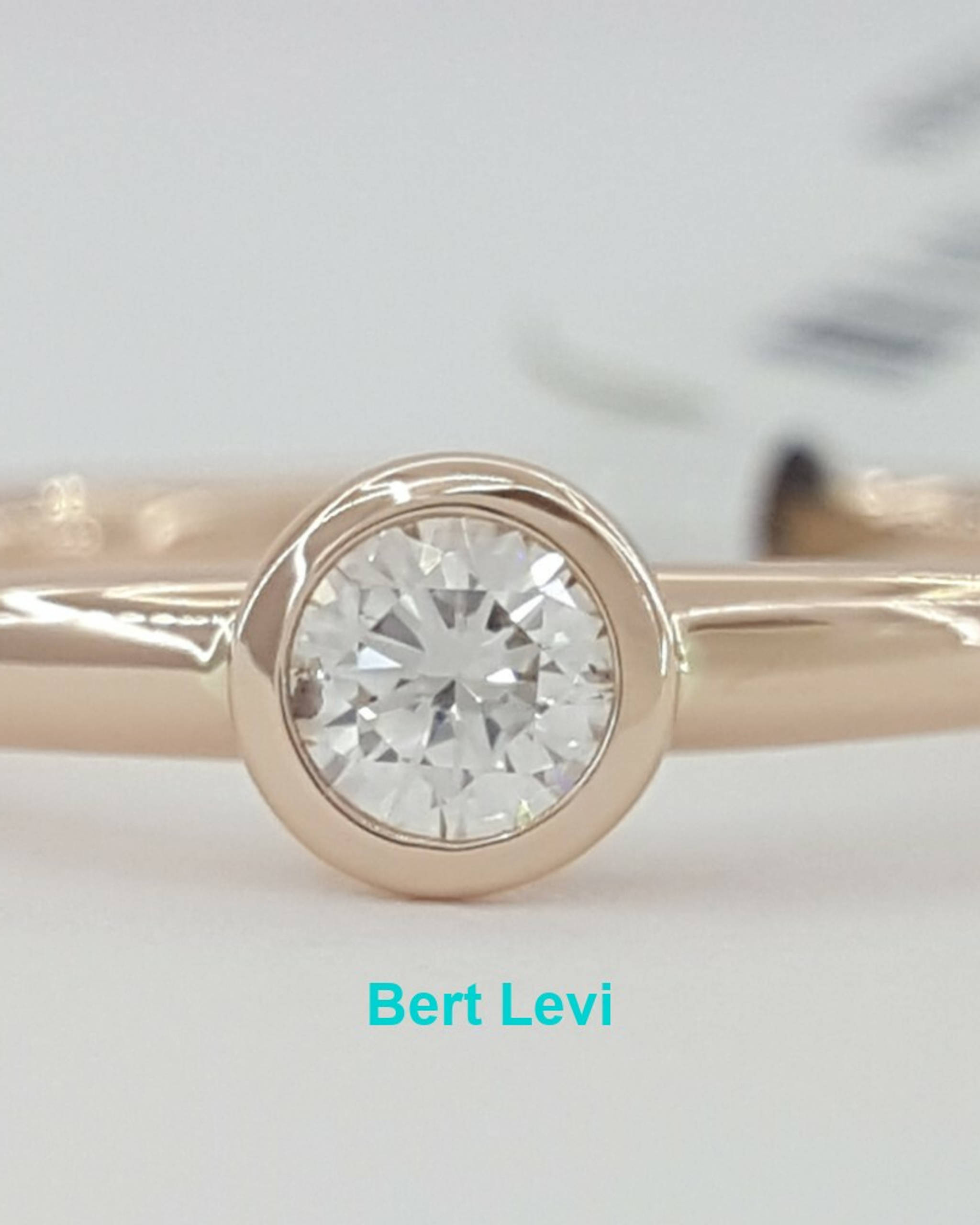 0.21 ct 14K Rose Gold Bezel Set Round Cut Diamond Solitaire Engagement Ring