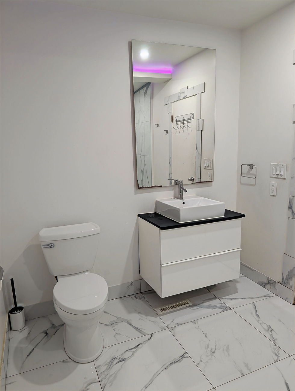 Modern residential bathroom renovation with floating vanity