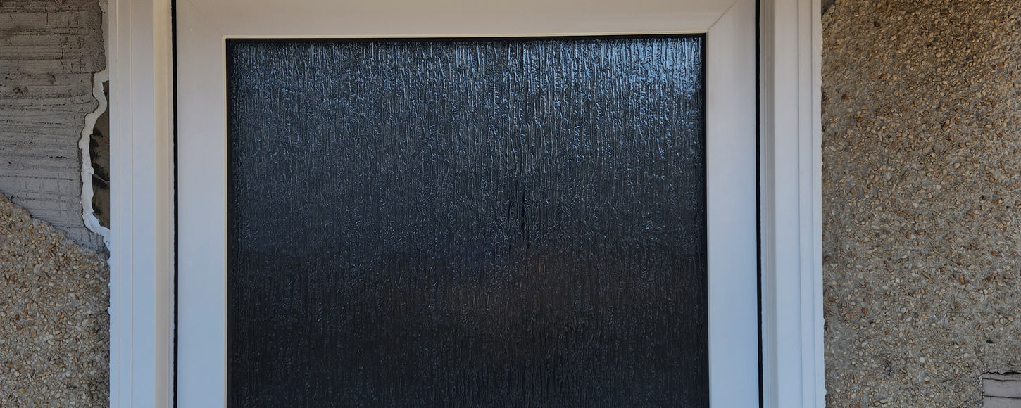 Exterior photo of an awning window replacement project in Regina, Saskatchewan by B-Flex Services.