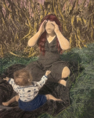 Woman playing "Peek-a-boo" with a baby.