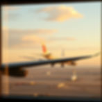 an airport and show flight taking off through the window as background.jpg
