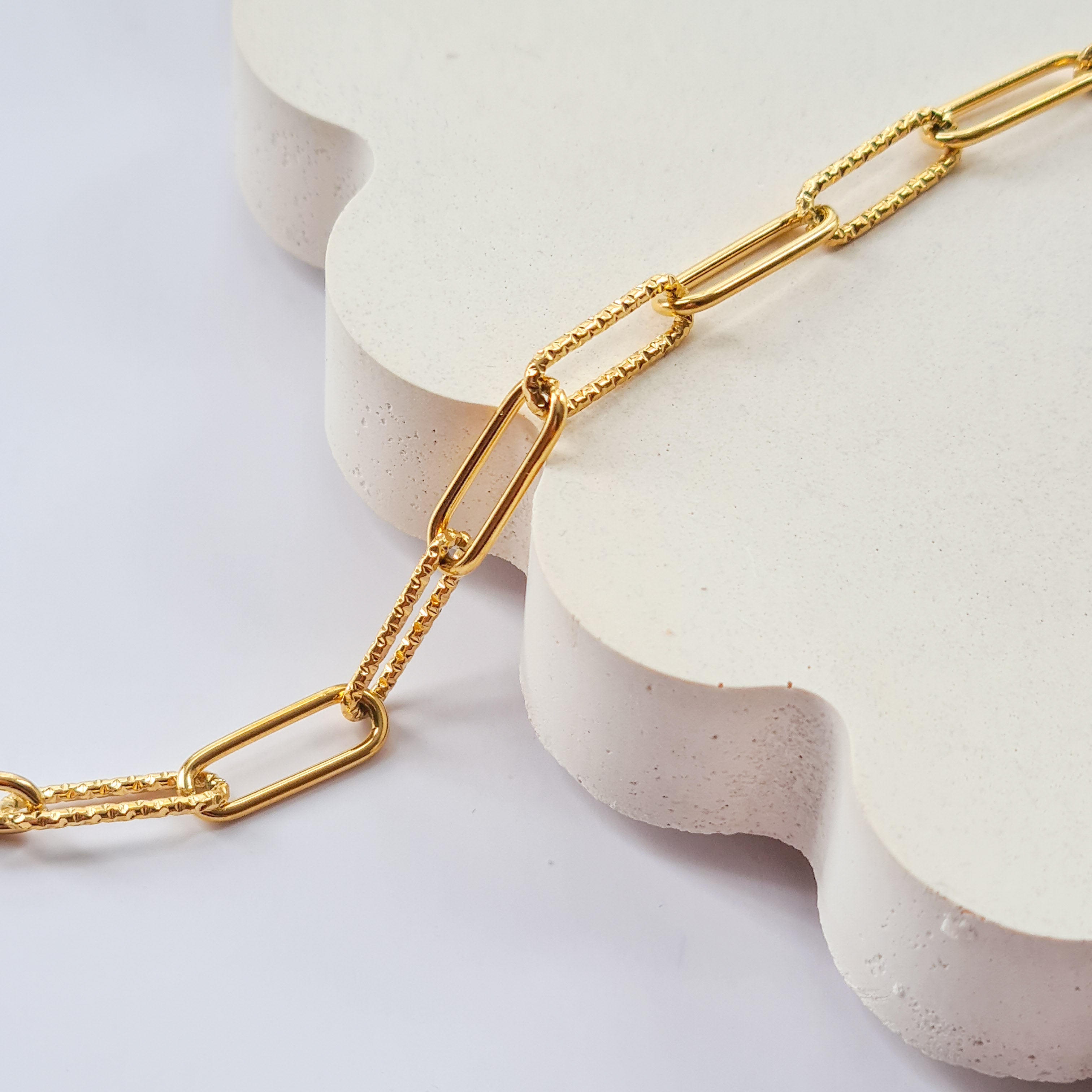 Paperclip style shaped chain close up