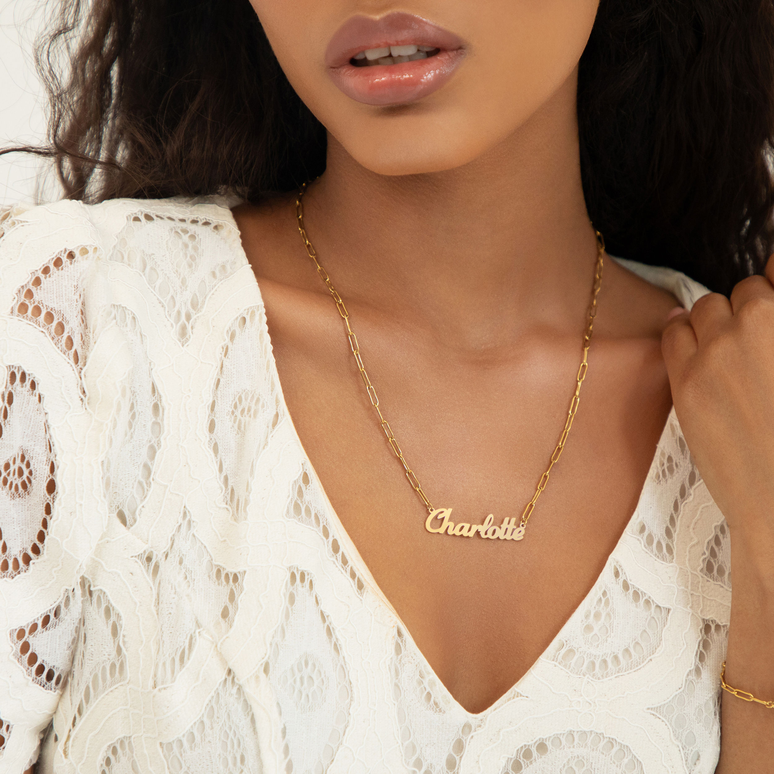 Model wearing personalised name necklace with paperclip link chain