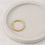 Thumbnail: Adjustable gold bubble ring on trinket dish