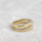 double layer gold ring. Top layer band is a twist, bottom layer smooth gold band.
