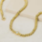 Gold plated beaded chain with zirconia stone in centre