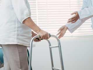 Patient with hands on walker grips