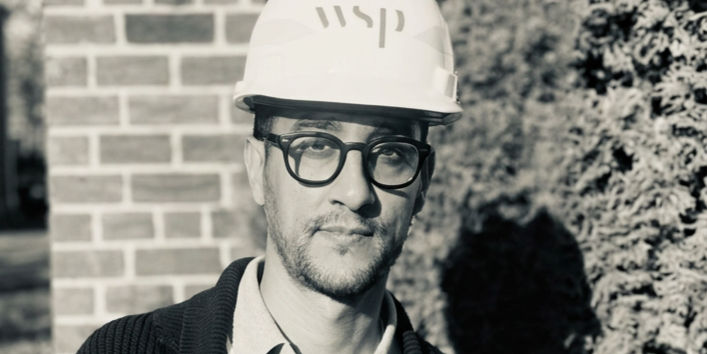 Engineer wearing WSP hard hat and glasses