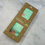 Thumbnail: green swaddle with pink flamingo pattern in a box