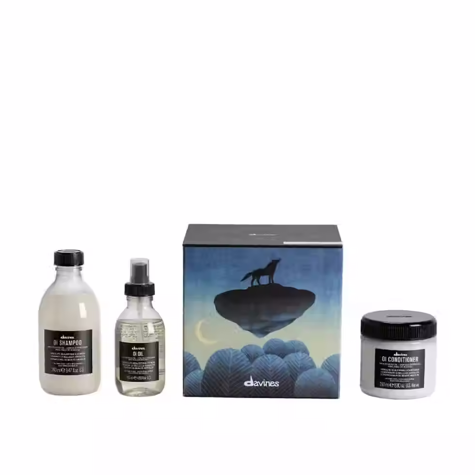 Davines OI Precious Temperate Forest Gift Set with OI Shampoo, OI Conditioner and OI Oil in wolf-themed festive box.