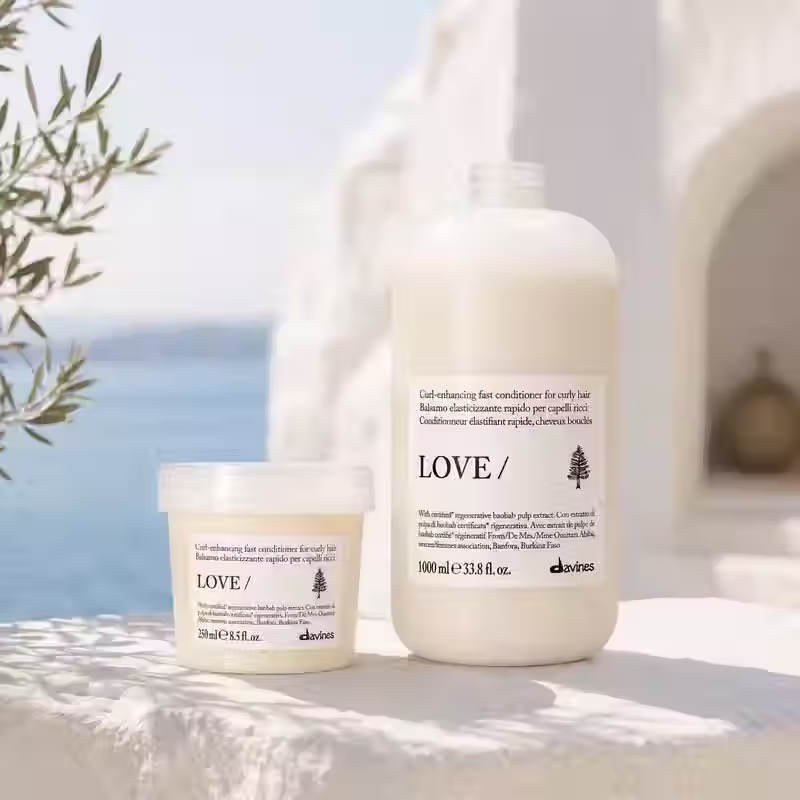 Thumbnail: Davines LOVE CURL Conditioner 250ml and 1000ml in Mediterranean coastal setting