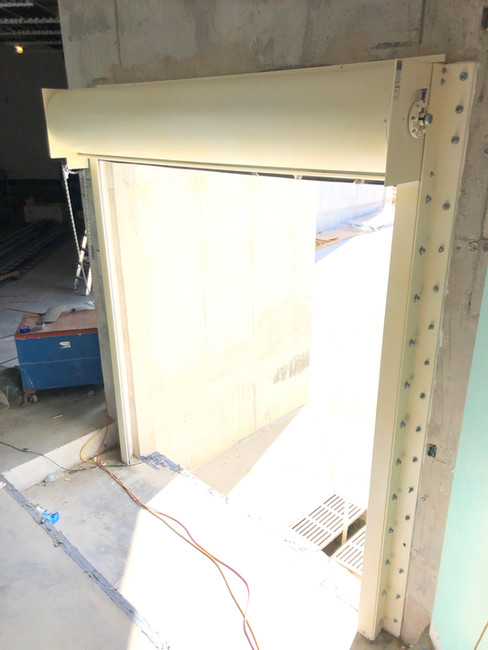 Peelable plastic spray coating for metal doors Fosters supermarket Phoenix Construction Cayman Islands