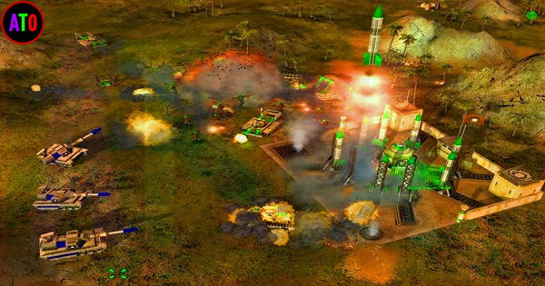 معركة عسكرية تجري في منطقة خضراء. دبابات تطلق النار، انفجارات ودخان مرئي. مبانٍ ومنشآت صاروخية خضراء تظهر في الخلفية.