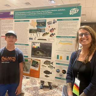 PhD student Beth Field gives her first research poster at the 100th Annual meeting of the American Society of Parasitologists.