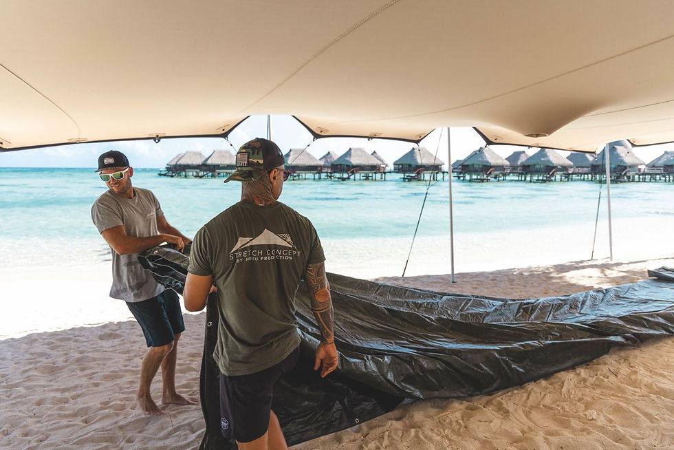 Arnaud Kressmann (white glasses) works with his team to put up and take down the tents.