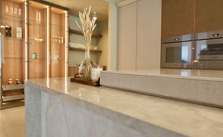 Japandi-style kitchen by Interiology™ featuring natural wood veneers, matte stone surfaces, and soft neutral tones for a sere