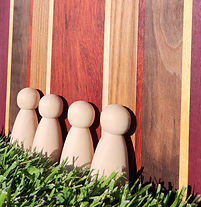 hardwood doll bodies with vertical lines backdrop (2025 Copyright | All Rights Reserved)