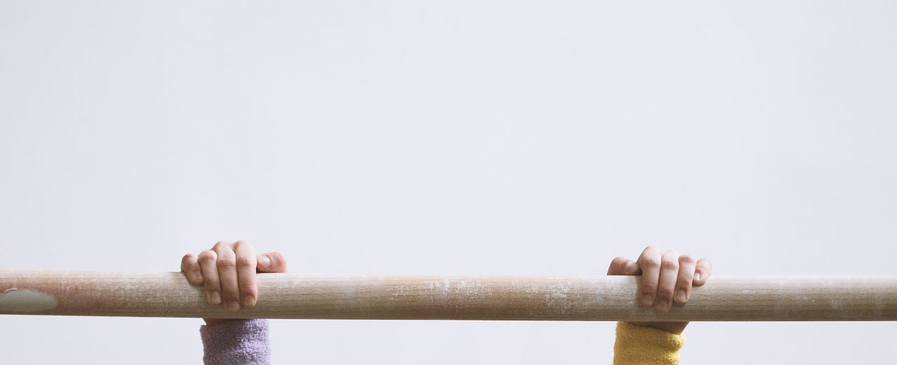 Gymnast on a Wooden Bar