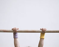 Gymnast on a Wooden Bar